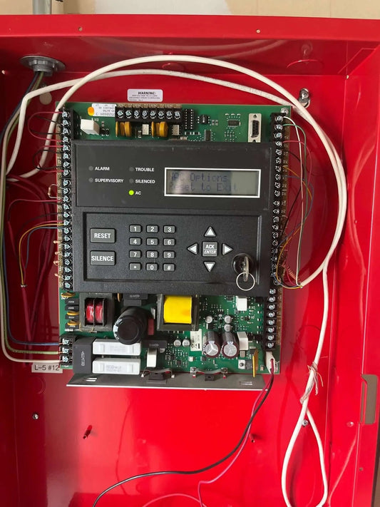 Commercial fire alarm control panel monitored by Avenger Security Services in Austin, Texas