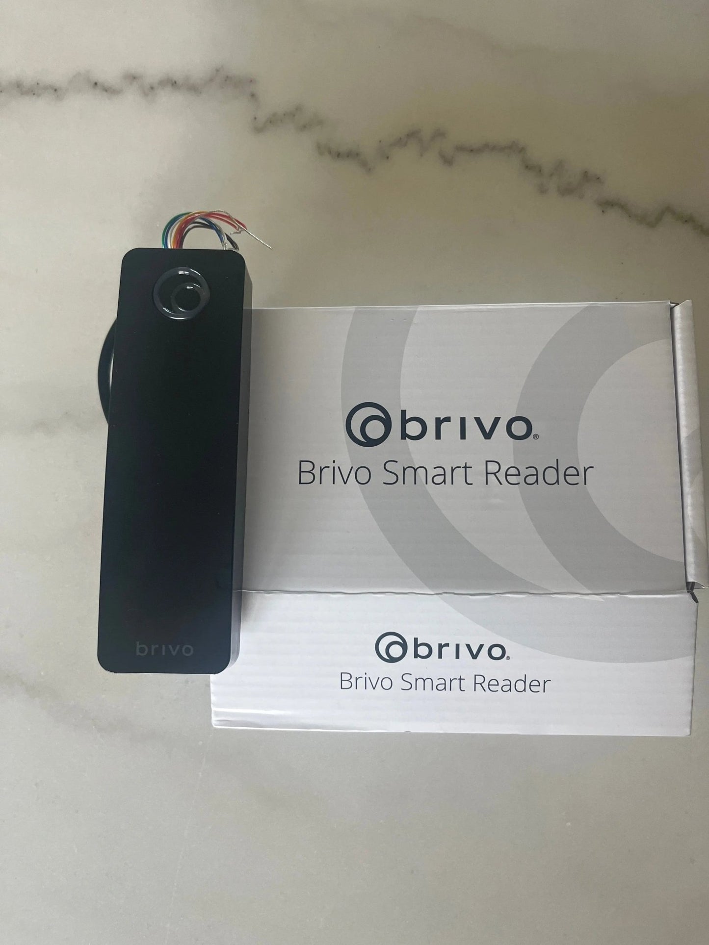 Tri-technology Brivo OSDP door reader (B-BSPMF-B) with Bluetooth Mobile Pass, smartcard, and prox support for secure access control.